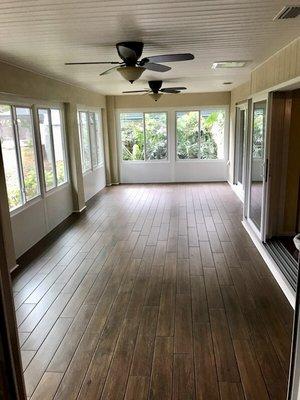 Sun room with HVAC, windows and porcelain tile flooring.  Built by Graco Construction General Contractors in Hillsborough County Florida.