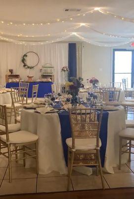 Beautiful table settings and candy bar in the back.