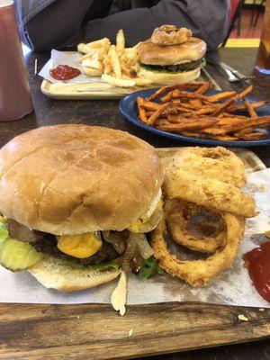 Big Rigo burger with onion rings and side of sweet potato fries.  Husband had a regular cheeseburger.