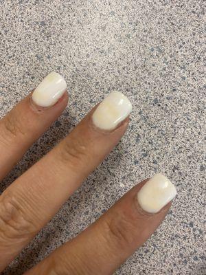 Yellow spots on white gel nails