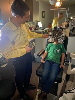 Dr. Eckel completing my sons eye exam!