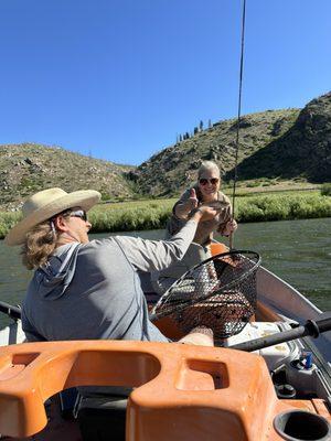 Our guide, Rob, holding up the smallest fish we caught and letting us be silly with it