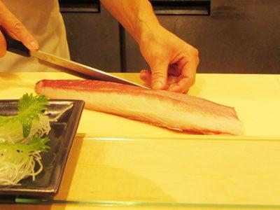 Taku prepearing sashimi.