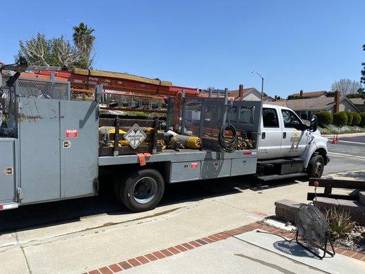 The super large truck arriving with tents, hoses,ladders, fans, and everything needed for tenting.