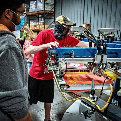 Silkscreen applications for Cincinnati State sweatshirts.