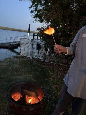 Hubby roasting marshmallows in the back of our cottage