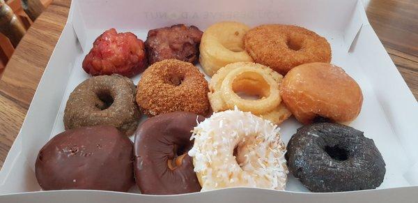 raspberry &apple fritter, glazed, cinnamon sugar, Blueberry, crueler, jelly, Boston cream, chocolate glazed, coconut, chocolate cake