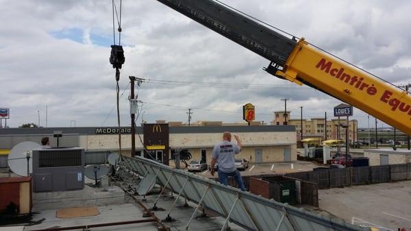 Carl directing the crane. (Big boys playing with big toys.)