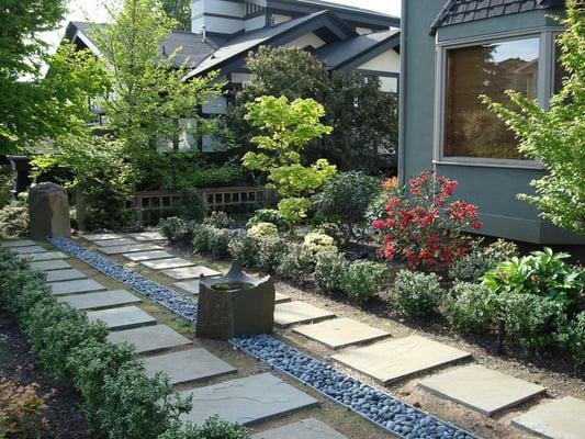 Columbia basalt columns create impressive focal points and low -maintenance basins for the birds to enjoy.