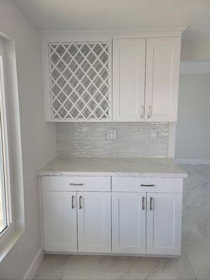 Coffee bar in Walnut, CA with custom cabinets and wine rack.