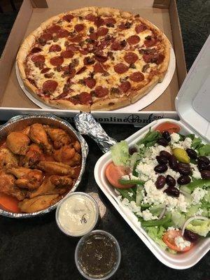 'Za, pie cut if u ask, baked wings, & Greek salad