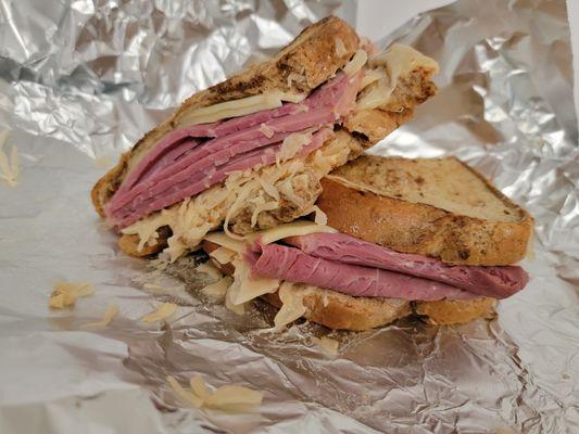 The Morning Mingle Reuben Sandwich 
Toasted rye bread, piled high with corned beef, sauerkraut, thousand island dressing, and Swiss cheese.