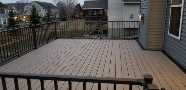 Trex composite deck with an accented picture frame .