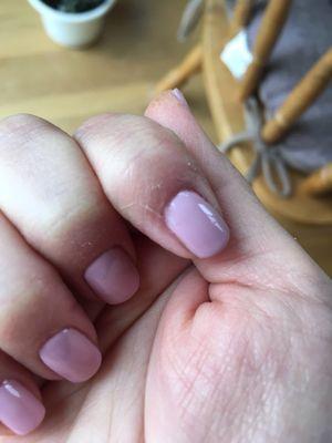 Excess polish smeared around nails.