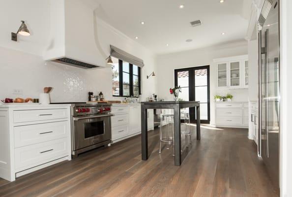 Wide solid white oak sanded and stained on site.