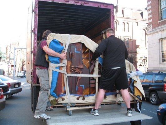 Piano Movers and Grand Piano on the lift gate.