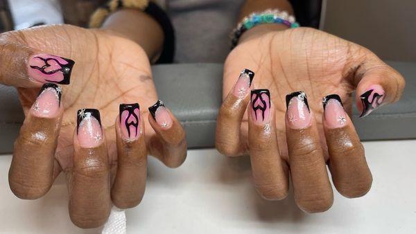 Nails by Sam. he can do any designs. bring a photo and let us do the work.