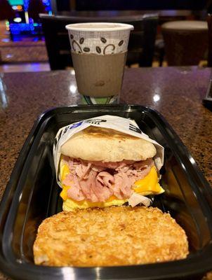 Egg cheese ham English muffin breakfast sandwich & potato pancake