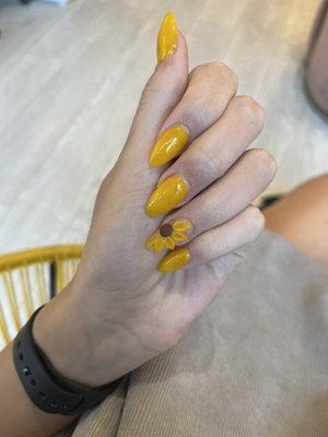 3-D sunflower nail art. Absolutely stunning I am in love. I highly recommend.