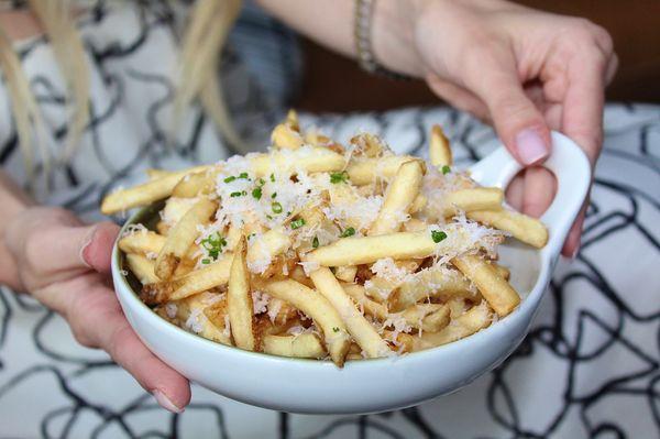 The Truffle Fries are made with grated parmesan and black truffle aioli.