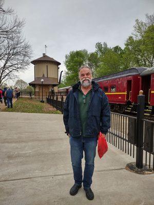 My hubby with the train behind him