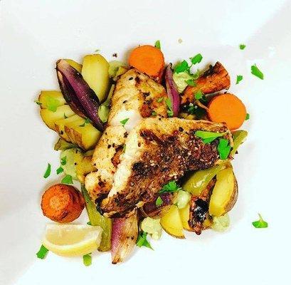 Gulf coast snapper with hasselback potatoes and grilled vegetables.