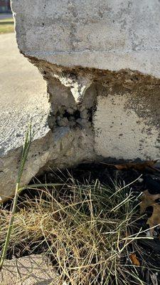 Exposed rebar and crumbling corner