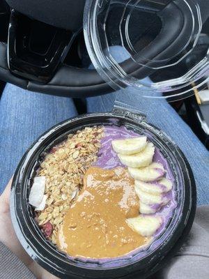 Smoothie bowl with berry base, banana, peanut butter and granola. Yum!