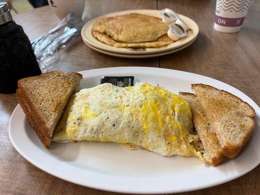 Western Omelet with wheat toast and a side of 2 pancakes