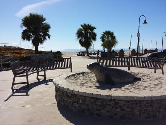 City sculptures and walkway to the beach.