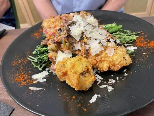 Chicken fried redfish over a bed of grilled broccolini!