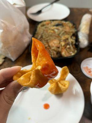 Signature Krab Rangoon in dipping sauce.