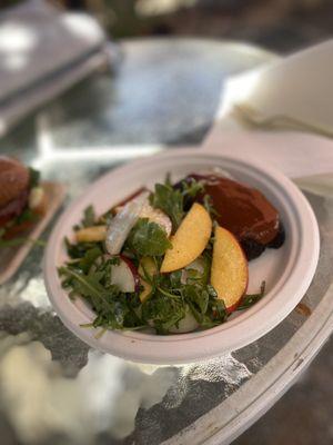 Pork belly with arugula and peach salad