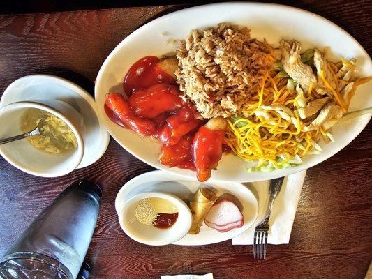 Combo dinner with lo mein,  fried rice, sweet and sour chicken, egg flower soup, BBQ pork and an egg roll