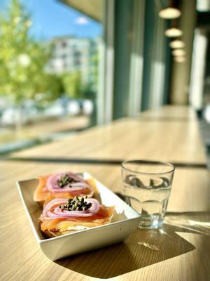 Open faced lox on rosemary bagel