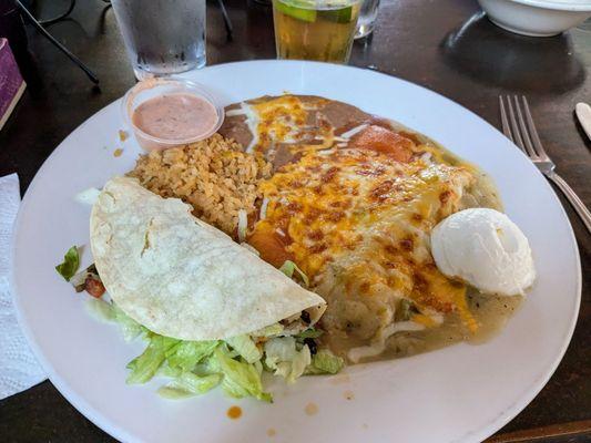 Combination meal with fish taco, cheese enchilada, and green tamales