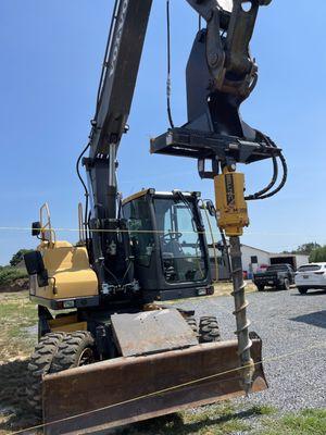 Auger mounted on excavator