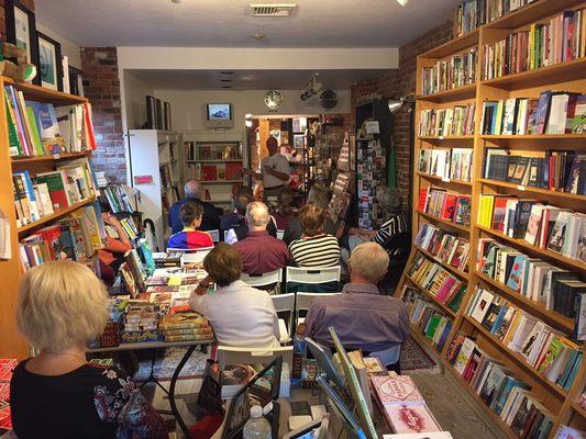 Author John Tabellione presenting his book "Pitstops, Pitfalls and Olive Pits."