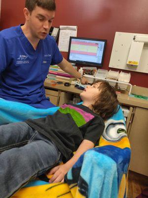 Our 5 year old talking with the anesthesiologist prior to his procedure.