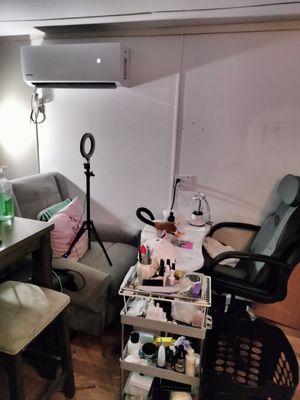 Home studio. Nail Tech booth with spa style Mani Pedi with massage chairs and full pedicure bath.