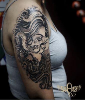 Black and grey tattoo done by Droe