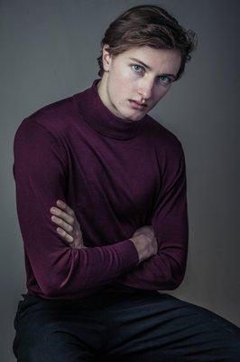 Male model in long sleeve maroon turtle neck