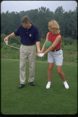 TOP 50 Golf Teacher Don Peterson helps student.