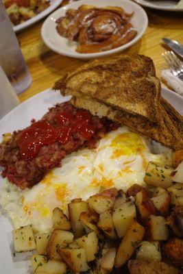 Homemade corn beef hash with rose, easy, eggs, and home fries. Can't go wrong with this one.