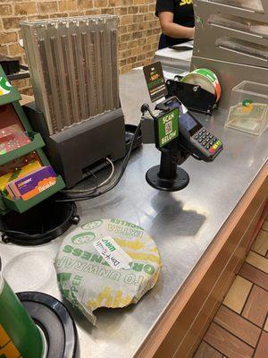 Mobile phone on food surface prep counter