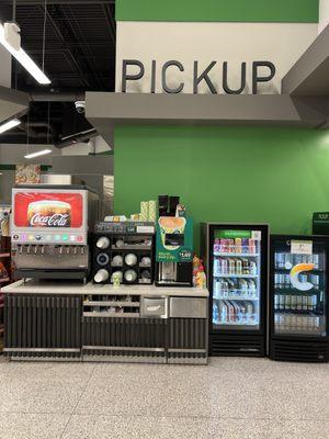 Drink fountain, is adjacent to the Grocery Pickup and Customer Service counter.  Deli is around the corner.