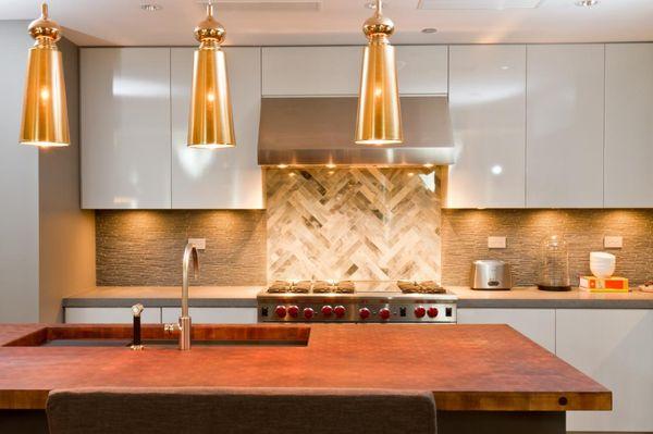 Modern kitchen with real hammered copper countertops and herringbone tile