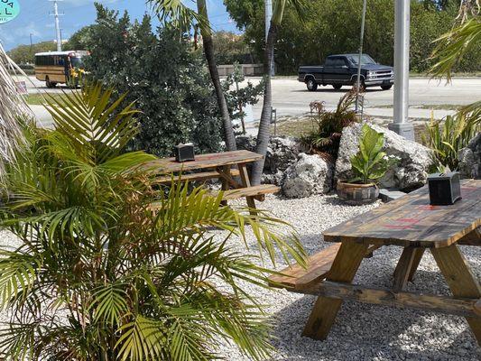 Picnic tables to sit outside of hut