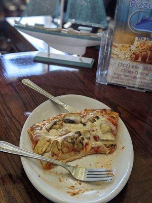 Excellent slice of fresh mushroom pizza. Crisp crust, good sauce and cheese. Sorry, I ate some of it before photo