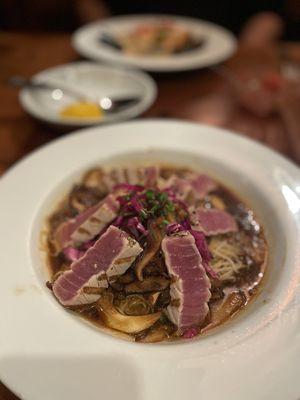 RARE PEPPERED AHI - $35.00
 Black peppered crusted ahi, grilled rare, shimeji mushrooms,mustard sesame-soy vinaigrette, angel hair pasta